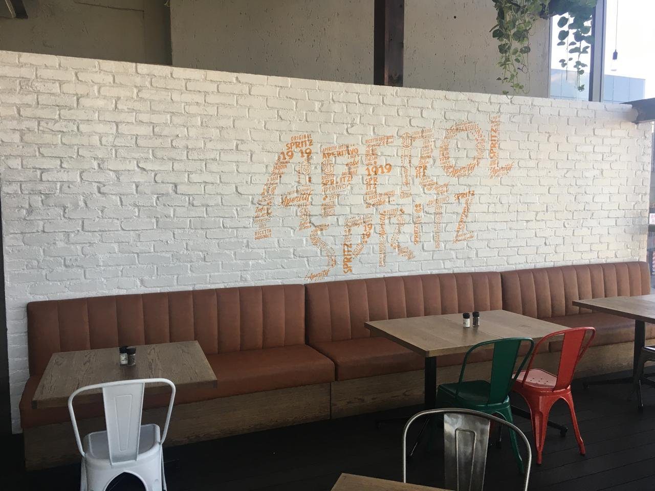 Aperol Spritz feature wall wrap in a restaurant